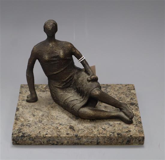 After Henry Moore. A bronze figure of a seated woman H.17cm
